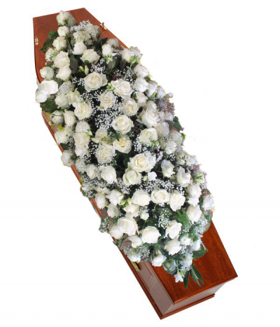 Snow White - A bed of stunning white roses, gypsophila and luscious green foliage, a simply stunning tribute.