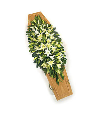 Pure Lilies - A stunning classic, all white fragrant lilies with glossy foliages and a touch of green hypericum berries.