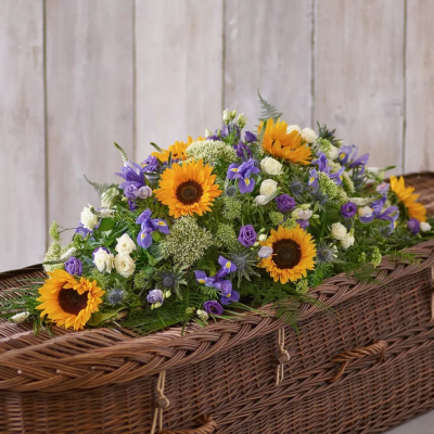 Sunflower Garden - A summery selection of blues and whites amongst striking sunflowers for a rustic style tribute.
Please note that sometimes certain flower types may need to be substituted due to seasonal availability.