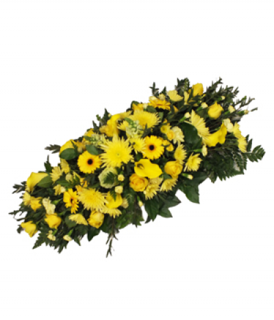 Sunshine Yellows - A bright tribute to someone special, featuring varied shades of yellow seasonal flowers.