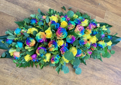Rainbow Rose - An enchanting mix of rainbow-dyed roses alongside yellow roses and solidago, and combined with beautiful foliage.