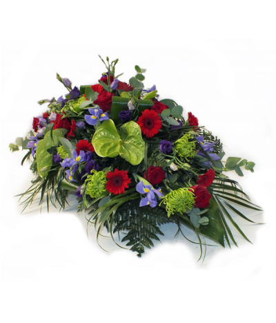 Deep Emotions - A striking tribute comprised of rich reds, deep purples and lime greens. 
Please note that sometimes certain flower types may need to be substituted due to seasonal availability.