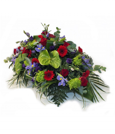 Deep Emotions - A striking tribute comprised of rich reds, deep purples and lime greens. 
Please note that sometimes certain flower types may need to be substituted due to seasonal availability.