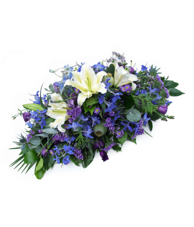 Seaside Memories - Stunning blues and purples nestled in eucalyptus and green foliages, with beautiful open white lilies as a central feature.