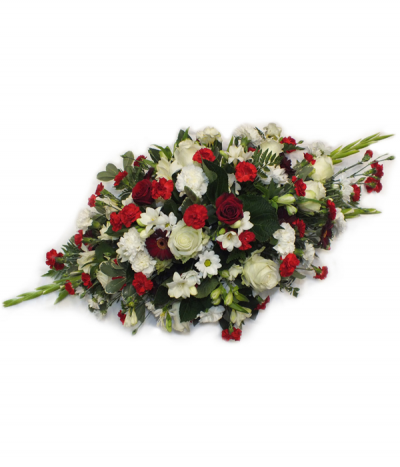 Sweet Farewell - A traditional, neat spray of reds and whites- including roses, freesias, carnations, chrysanthemums and more.