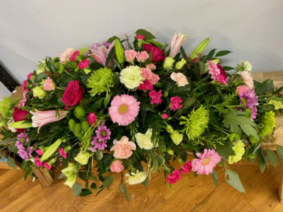 Cerise & Lime - A bright and zesty selection of cerise-pink, lime green and softer pink blooms, including roses, chrysanthemums, lilies and spray-carnations.