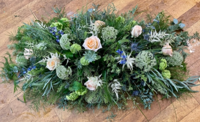 Meadow Mist - A frothy, wild spray consisting of lots of mixed foliages and grasses as a main focus alongside natural filler flowers such as viburnum, ammi and astilbe (this can vary depending on seasonal availability). Cream roses and hints of blue thistle and delphinium are dotted through to give a nod of colour.