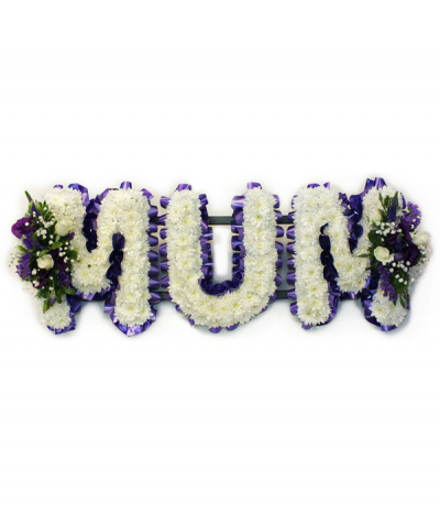 MUM 02 - Lettering "Mum" massed in white chrysanthemums, finished with dainty purple and white sprays at each end. Letters are framed with purple pleated ribbon edging.
Any wording can be created in this style, and colours can be altered to suit your preferences- please call us to discuss.