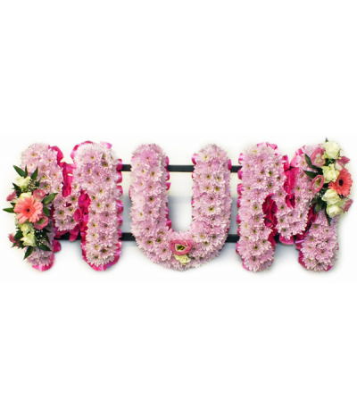MUM 06 - Lettering "Mum" massed in pink chrysanthemums, finished with dainty pink and white sprays at each end. Letters are framed with bright pink pleated ribbon edging. Any wording can be created in this style, and colours can be altered to suit your preferences- please call us to discuss.