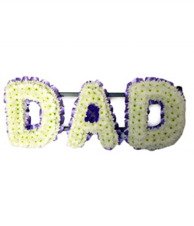 DAD 03 - Lettering "Dad" massed in white chrysanthemums, simply finished with lilac pleated ribbon edging. Any wording can be created in this style, and colours can be altered to suit your preferences- please call us to discuss.