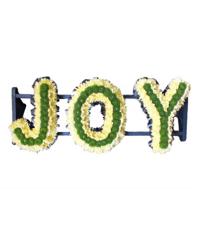 Three-letter name tribute (Joy) - Example lettering "Joy" massed in pale yellow/cream chrysanthemums, with a lime green pom-pom chrysanthemum stripe, and finished with dark navy pleated ribbon edging. Any wording can be created in this style, and colours can be altered to suit your preferences- please call us to discuss your requirements or note your three-letter name in the "any special requests" box to order online.