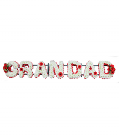 Grandad 3 - Lettering "Grandad" massed in white chrysanthemums, finished with red flower sprays at each end and with red mini gerberas dotted through. Letters are framed with red pleated ribbon edging. Any wording can be created in this style, and colours can be altered to suit your preferences- please call us to discuss.
