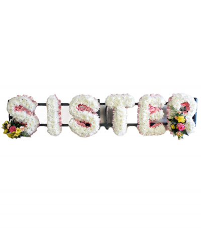 Sister - "Sister" lettering in white massed chrysanthemums, framed with a soft pink pleated ribbon edging and finished with pretty pink and yellow flower sprays.
Any wording can be created in this style, and colours can be altered to suit your preferences- please call us to discuss.
£45.00 per letter.