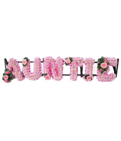 Auntie - Pretty pink-based "Auntie" lettering with hot-pink pleated ribbon edging and finished with rose sprays to compliment.
Any wording can be created in this style, and colours can be altered to suit your preferences- please call us to discuss.
£45.00 per letter