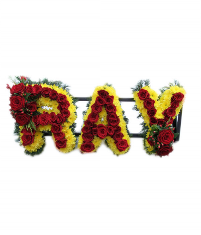 Three-letter name tribute with roses (Ray) - Example lettering "Ray" massed in bright yellow chrysanthemums, with a beautiful line of luxury red roses through the centre, and finished with two sprays of red roses and berries.  The letters are finished with natural greenery edging. 
Any wording can be created in this style, and colours can be altered to suit your preferences- please call us to discuss your requirements or note your three-letter name in the "any special requests" box to order online.
£75.00 per letter in this style with roses.