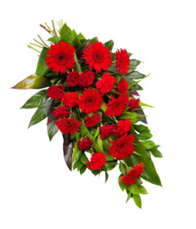 Ruby Red - A natural tied sheaf of stunning red seasonal flowers and lush foliages. Including red gerberas, roses and carnations. 
Image shown is size Medium.