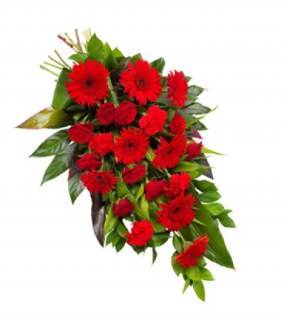 Ruby Red - A natural tied sheaf of stunning red seasonal flowers and lush foliages. Including red gerberas, roses and carnations. 
Image shown is size Medium.