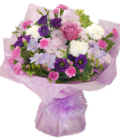 Princess - A pretty handtied bouquet in water and presented in a gift bag/box. Created using a seasonal selection of soft pinks, bright pinks, purple and a touch of white.