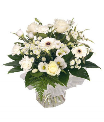 Pure Whites - A classic and elegant handtied bouquet of all white and cream seasonal flowers arranged in water and presented in a gift bag/box.
