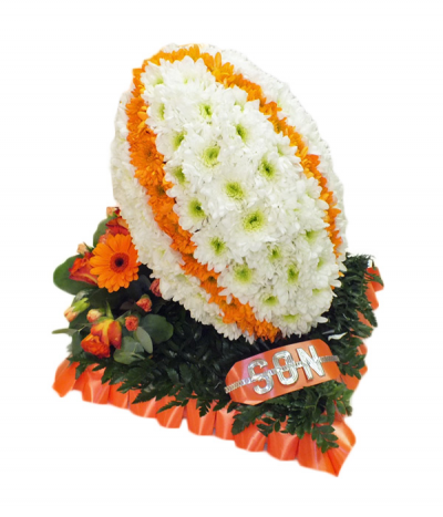 Rugby Ball Orange - A beautifully crafted rugby ball tribute, using massed chrysanthemums to create an orange-striped ball and finished on a "grass" base with complimenting orange flower spray