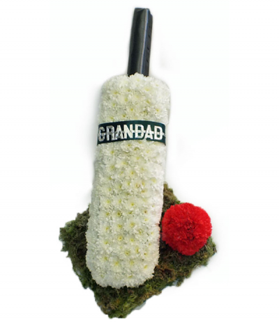Cricket Bat & Ball - For those with a passion for cricket, this tribute features and upstanding cricket bat crafted from white massed chrysanthemums, complete with a red ball and stood on a mossed base