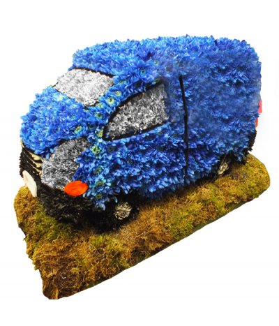 Transit Van Tribute - A large 3D transit van tribute, massed in dyed blue and silver chrysanthemums with black trimmings and stood on a mossed base.