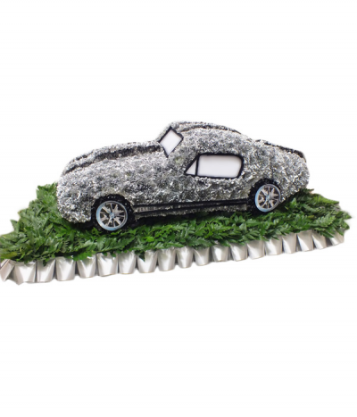 Sports Car 3D - An impressive 3D sports car design, crafted from dyed silver chrysanthemums with black trimmings and laminated wheel images. On a green base, framed with silver pleated ribbon