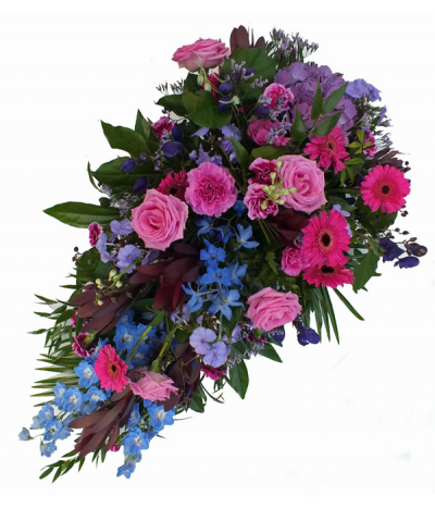 Glorious Garden - A vibrant single-ended spray tribute using seasonal hot-pinks, mauves and blues and  including gerberas, roses, delphinium among other seasonal flowers.