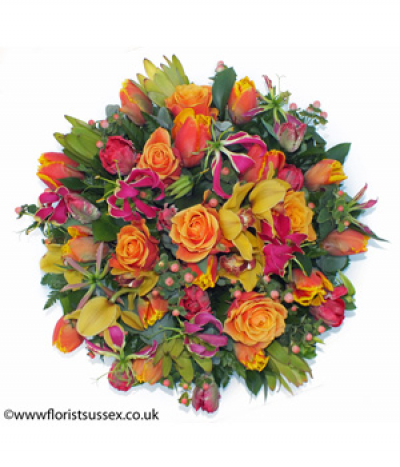 Radiant Remembrance Posy - A zesty combination of striking orange, yellow, hot-pink and lime for a more contemporary take on the posy pad tribute.