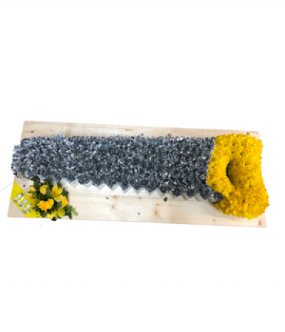 Carpenter Saw Tribute - A fantastic tribute to a carpenter/woodworker- a customisable saw tribute, created using massed chrysanthemums which are expertly dyed to the required colours.