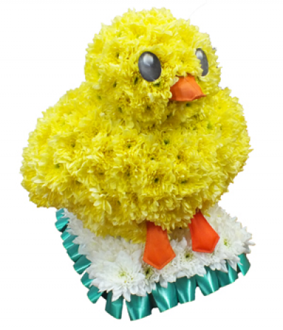 Emoji Chick Tribute - A 3D "emoji" chick design tribute, massed in bright yellow chrysanthemums and stood on a white square base with pleated ribbon edging.