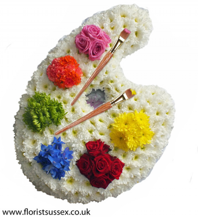 Painter's Palette - A fitting tribute for an artist, this palette design features white chrysanthemums as a base, with varied, bright posies of flowers for each colour of "paint".