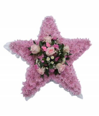 Pink Star Tribute - A pretty star-shaped design using natural pink chrysanthemums as a base, with a pink and white rose and mixed flower spray in the centre to compliment.