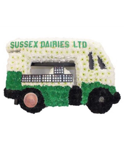 Milk Float Tribute - A special 2D milk float design, crafted using massed chrysanthemums in white, green and black, and finished with lettering decals and "milk crates" on board!