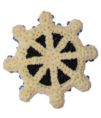 Ship's Wheel - A custom ship's wheel tribute, based in white chrysanthemums and neatly edged using pleated blue ribbon.