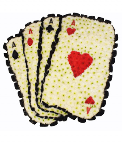 Playing Cards Tribute - A striking four aces playing cards design, using massed chrysanthemums with the ace of hearts at the front. Each card is edged with black pleated ribbon.