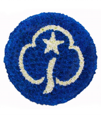 Girl Guide Badge - A circular pad tribute depicting the Girl Guiding logo in white against a royal-blue background, all expertly created using massed chrysanthemums.