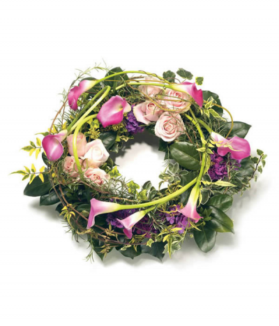 Calla Wreath - A natural, hedgerow-inspired design entwined with expertly looped and twisted calla-lilies as a feature, and complimented with soft pink rose clusters amongst various foliages