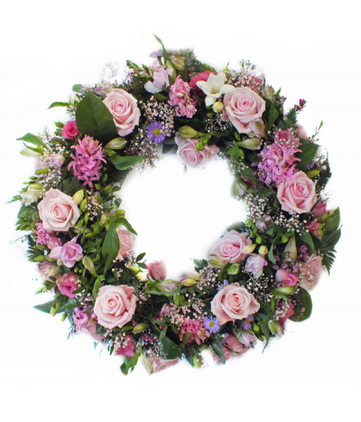 Soft Romance Wreath - A pretty and delicate selection of soft pink tones, featuring roses, freesias, gypsophila, alstromeria, hyacinths (when available) and much more- a beautifully scented tribute
