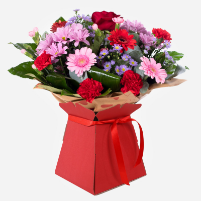 Mrs Kisses - Send lots of love and kisses with this classic hand-tied bouquet featuring a selection of romantic flowers finished with a luxurious single red rose.