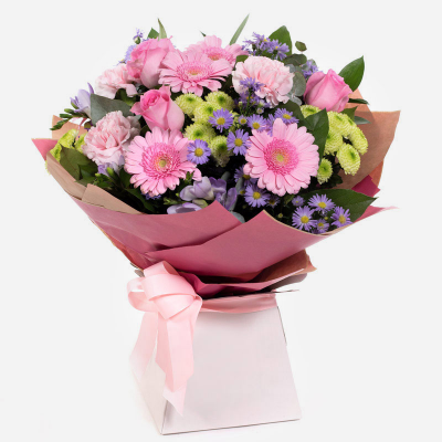 Warm Wishes - Send this vibrant hand-tied featuring a mix of favourite flowers delivered in a delightful gift bag or box is the perfect way to send your thoughts.