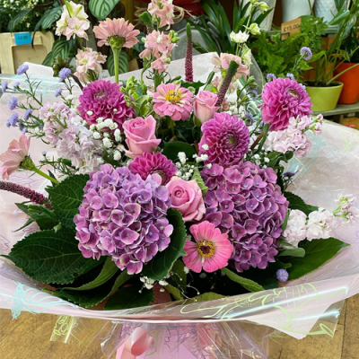 Sweet Escape - A delightful handtied bouquet in water presented in a gif bag/box. Created using pink and white flowers with complimentary foliage. Hand delivered with care in and around Littlehampton by Findon Flowers