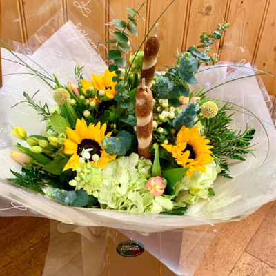 Sunny Daze - A lovely handtied bouquet in water presented in a gif bag/box. Created using yellow and white flowers with complimentary foliage. Hand delivered with care in and around Littlehampton by Findon Flowers